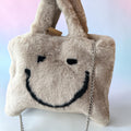 Fake bont tasje met smiley beige