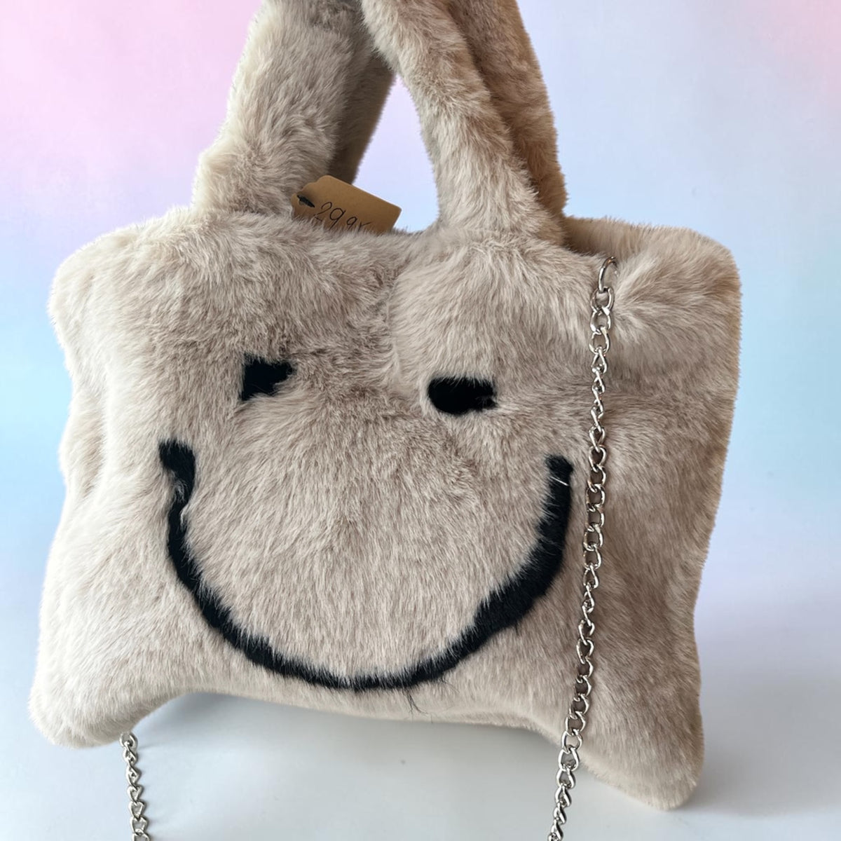 Fake bont tasje met smiley beige